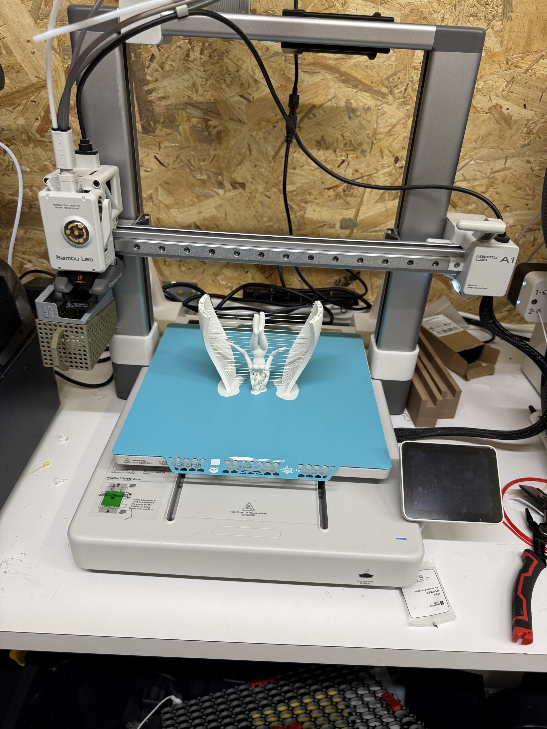 A 3D printer working in Layer3D’s converted-garage workshop